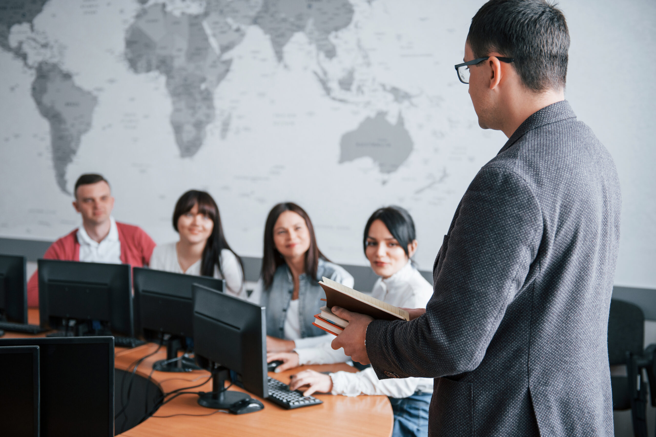 how is your deals. group of people at business conference in modern classroom at daytime
